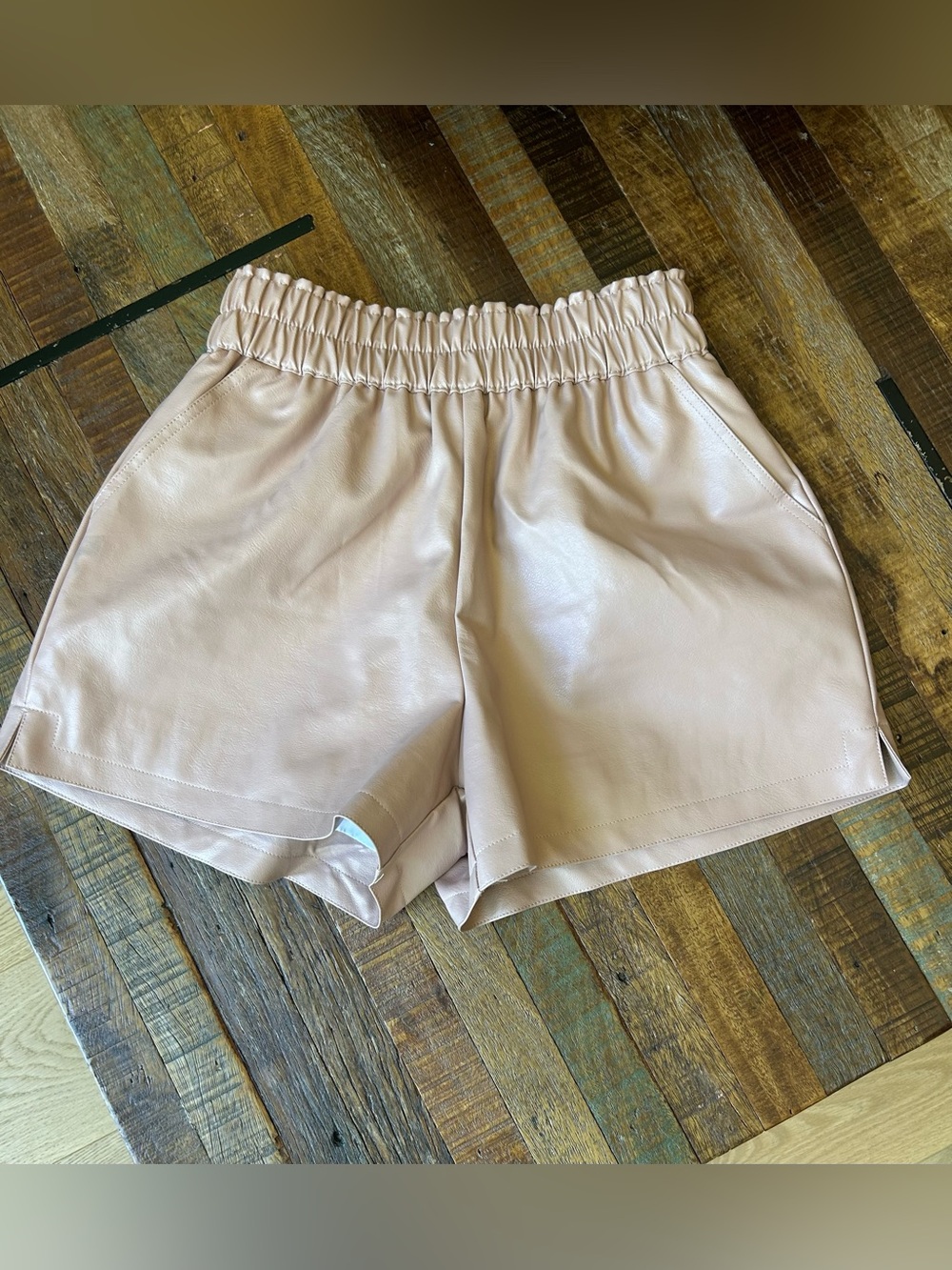 Women's Pale Pink/Blush Faux Leather Elastic Waist Shorts with pockets.